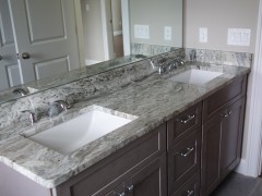 Double vanity with granite countertops in main bathroom