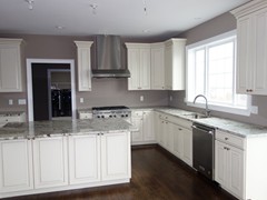 Kitchen featuring granite countertops and upgraded cabinets