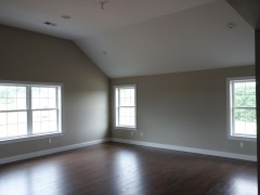 Master bedroom with cathedral ceilings