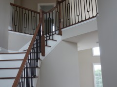 Stairway to second floor with iron spindles