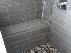 Tile floor and bench in master shower