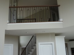 View of second floor balcony overlooking the family room