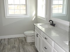 Ceramic tile flooring standard in all bathrooms.