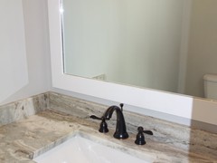 Custom cut granite countertops and backsplash are standard in all bathrooms.