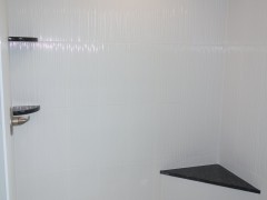 Custom design elements in the walk-in master shower