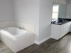Full size tub in master bathroom